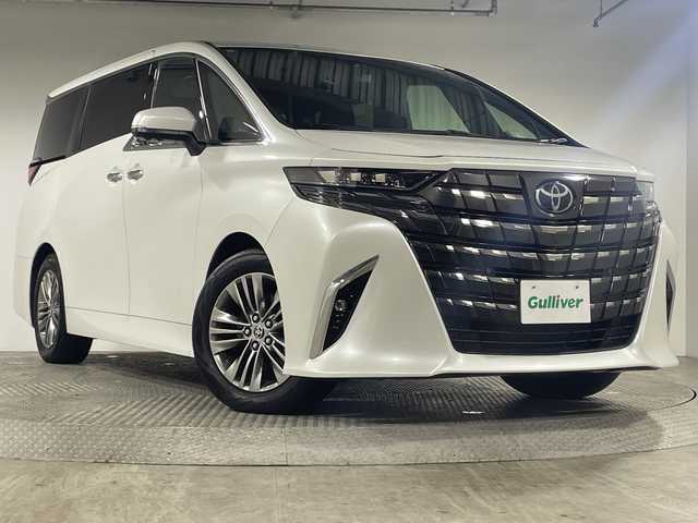 トヨタ アルファード Z 神奈川県 2024(令6)年 1.1万km プラチナホワイトパールマイカ トヨタセーフティセンス/純正14型ディスプレイオーディオ/・ナビ/フルセグTV/BT/USB/MiraCast/パノラミックビューモニター/左右独立ムーンルーフ/デジタルインナーミラー/置くだけ充電/レザー調シート/パワーシート(D/N/二列)/メモリシート(D)/シートヒーター(D/N/二列)/ベンチレーション(D/N/二列)/MTモード/ブラインドスポットモニター/電動サイドブレーキ/オートブレーキホールド/パワーバックドア/三眼LEDヘッドライト/前後ドライブレコーダー/ビルトインETC2.0/電動サンシェード/オットマン/二列目タイプC/ウッドコンビステアリング/ステアリングスイッチ/Autoライト/ステアリングヒーター/スマートキー/プッシュスタートボタン/フォグランプ/電動格納ミラー/ウィンカーミラー/SOSコール/純正フロアマット/純正18インチアルミホイール