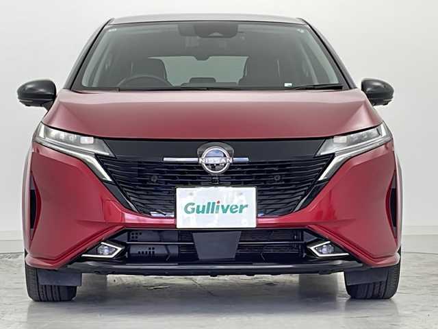 日産 オーラ G 宮城県 2022(令4)年 6.2万km ガーネットレッド/スーパーブラック 2トーン プロパイロット/車線逸脱警報/アダプティブヘッドライト/ブラインドスポットモニター/ＢＯＳＥサウンド/純正９型ナビ/BT.USB.HDMI/全周囲カメラ/フルセグTV/ＥＴＣ２．０/デジタルインナーミラー/ドラレコF/革巻ステアリング/ステアリングスイッチ/電動パーキングブレーキ/プッシュスタート/スマートキー/純正フロアマッド/ハーフレザーシート/純正１７インチAW/LEDヘッドライト/LEDフォグランプ/横滑り防止機能