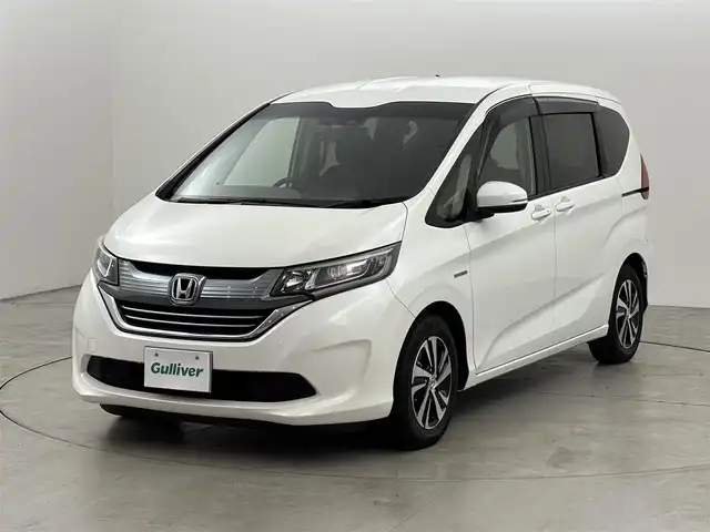 ホンダ フリード＋ ハイブリット EX 福岡県 2018(平30)年 6.1万km ホワイトオーキッドパール 純正ナビ　/デジタルルームミラー　/両側パワースライドドア　/ＥＴＣ　/ドライブレコーダー　/バックカメラ　/レーダークルーズコントロール　/衝突軽減被害システム　/レーンキープ　/シートヒーター　/純正１５インチＡＷ