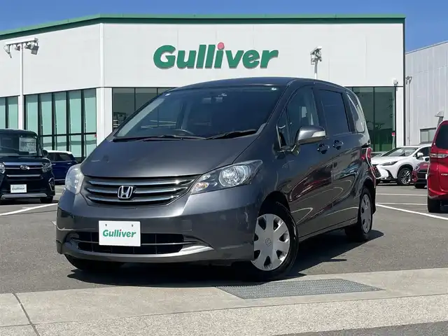 ホンダ フリード G ハイウェイエディション 愛媛県 2010(平22)年 9.7万km ポリッシュドメタルメタリック 登録時走行距離：96968Km/社外メモリナビ/AM/FM/フルセグTV/ＤＶＤ/USB/i pod/後席モニター/ETC/ＡＡＣ/ドラレコ/レザー調シートカバー/Bカメラ/片側パワスラ/盗難防止装置/キセノンヘッドライト/オートライト/リモコンキー/スペアキー1本/純正フロアマット