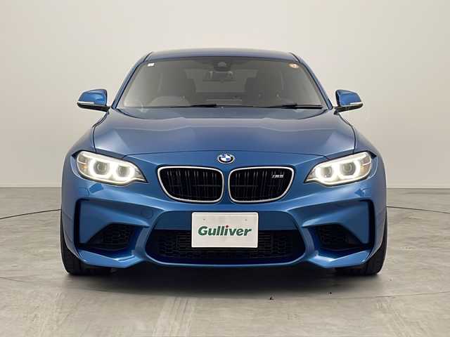 ＢＭＷ Ｍ２ 三重県 2017(平29)年 7万km ロングビーチブルーメタリック 禁煙車/純正HDDナビ/CD/DVD/BT/AUX/バックカメラ/衝突被害軽減ブレーキ/レーンキープアシスト/クルーズコントロール/レザーシート/シートヒーター/ビルトインETC/パドルシフト/オートライト/メモリシート/アイドリングストップ