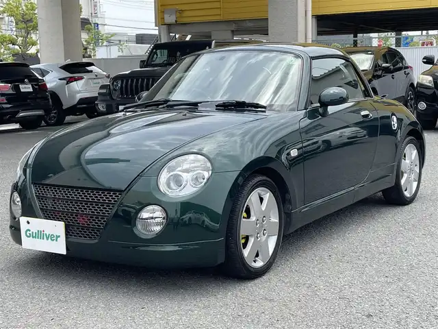 ダイハツ コペン アクティブトップ 和歌山県 2005(平17)年 8.5万km ダークグリーンマイカ 社外オーディオ（AM/FM/CD/AUX）/純正マット/純正アルミホイール/取扱説明書