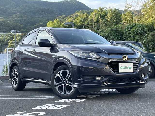 ホンダ ヴェゼル ハイブリッド Z 長崎県 2015(平27)年 12.8万km ルーセブラックM プッシュスタート/車両取扱説明書/ナビ取扱説明書/保証書/スマートキー/追従走行無しクルーズコントロール/純正SDナビ(BT/AM/FM/フルセグTV/SD)/純正フロアマット/純正17インチアルミホイール/オートライト/バックカメラ/ETC/ABS/VSA/イモビライザーシステム/車両接近通報装置/SRSサイド+カーテンエアバッグ