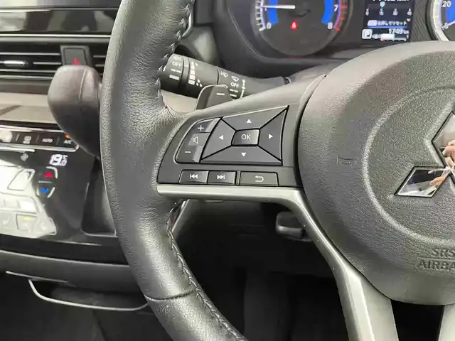 三菱 デリカミニ T プレミアム 栃木県 2025(令7)年 0.2万km オレンジⅡ 4WD/ターボ/デジタルルームーミラー/マルチアラウンドモニター/三菱e-Assist デリカミニ Tプレミアム/　衝突被害軽減ブレーキ/　踏み間違い防止アシスト/　オートハイビーム/　車線逸脱警告/　先行者発進通知/　標識認知システム/　車線維持支援/　ふらつき警報/　前方衝突予測警報/高速道路 同一車線運転支援機能 マイパイロット/レーダークルーズコントロール/ヒルディセントコントロール/両側パワースライドドア/ビルトインETC/ルーフレール/ステアリングヒーター/シートヒーター/アイドリングストップ/LEDヘッドライト/LEDフォグランプ/助手席シートバックテーブル/純正15インチアルミホイール/純正フロアマット(ラバータイプ)/スマートキー×2本/保証書、取扱説明書