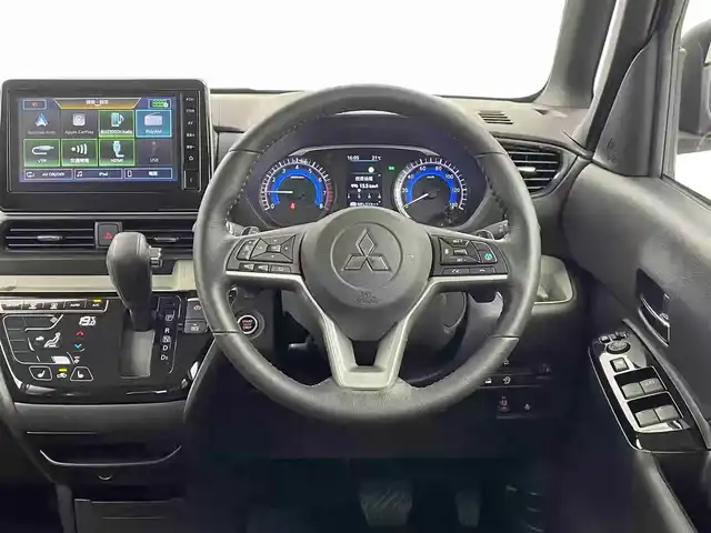 三菱 デリカミニ T プレミアム 栃木県 2025(令7)年 0.2万km オレンジⅡ 4WD/ターボ/デジタルルームーミラー/マルチアラウンドモニター/三菱e-Assist デリカミニ Tプレミアム/　衝突被害軽減ブレーキ/　踏み間違い防止アシスト/　オートハイビーム/　車線逸脱警告/　先行者発進通知/　標識認知システム/　車線維持支援/　ふらつき警報/　前方衝突予測警報/高速道路 同一車線運転支援機能 マイパイロット/レーダークルーズコントロール/ヒルディセントコントロール/両側パワースライドドア/ビルトインETC/ルーフレール/ステアリングヒーター/シートヒーター/アイドリングストップ/LEDヘッドライト/LEDフォグランプ/助手席シートバックテーブル/純正15インチアルミホイール/純正フロアマット(ラバータイプ)/スマートキー×2本/保証書、取扱説明書