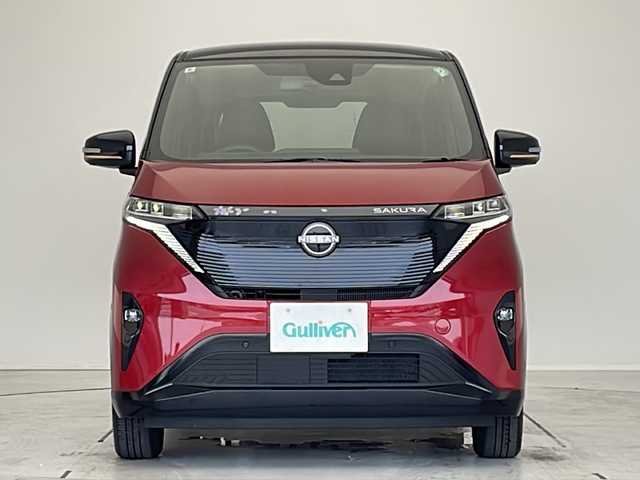 日産 サクラ X 90周年記念車 愛知県 2024(令6)年 0.3万km スパークリングレッド/ブラック プロパイロット/衝突軽減システム/純正9型ディズプレイオーディオ　ナビあり/全方位カメラ/クルーズコントロール/シートヒーター/フルセグ/Bluetzooth/バックカメラ/コーナーセンサー/純正アルミホイール/ETC2.0/LEDヘッドライト/ステアリングヒーター/オートライト/ドライブレコーダー/ステアリングスイッチ/スマートキー/プッシュスタート