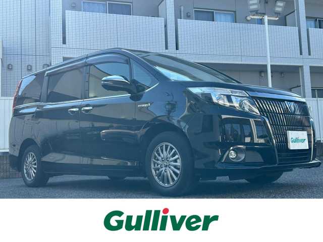 トヨタ エスクァイア ハイブリッド Gi ブラックテーラード 愛知県 2016(平28)年 5.7万km ブラック 社外８V型ナビ【Bluetooth CD DVD SD フルセグ 品番：AVIC-RL99】/ETC/バックカメラ/両側パワースライドドア/クルーズコントロール/衝突軽減ブレーキ/車両接近通報装置/レーンキープアシスト/先行車発信告知/前後コーナーセンサー/オートライト/オートマチックハイビーム/フォグランプ/ナノイー/ステアリングリモコン/合皮シート/前席シートヒーター/ウォークスルー/ドアバイザー/オート電動格納ドアミラー/純正フロアマット/禁煙車