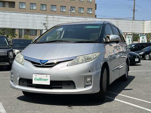 トヨタ エスティマ ハイブリッド G 京都府 2010(平22)年 18.4万km シルバーマイカM ＨＤＤナビ　/純正ＥＴＣ　/フルセグ　/後席モニター　/ＧＰＳソーラーレーダー　/パノラミックライブサウンド　/３列キャプテンシート　/ワイパーデアイサー　/オットマン　/電動格納サードシート/ニーエアバッグ/カーテンエアバッグ/ウォークスルー　/Bluetooth　/CD再生機能/シートヒーター/純正フロアマット/前後コーナーセンサー/横滑り防止装置