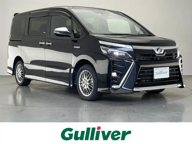 トヨタ ヴォクシー ハイブリッド ZS 煌Ⅱ 愛知県 2019(平31)年 2.8万km ブラック 純正１０型ナビ　純正１２型後席モニター　両側パワスラ　フルセグＴＶ　シートヒーター　バックカメラ　純正ドラレコ　ＥＴＣ　セーフティセンス　衝突軽減　レーンキープ　３眼ＬＥＤ　クルコン　プッシュスタート　スマートキー　コーナーセンサー　オートハイビーム　レーンキープ　