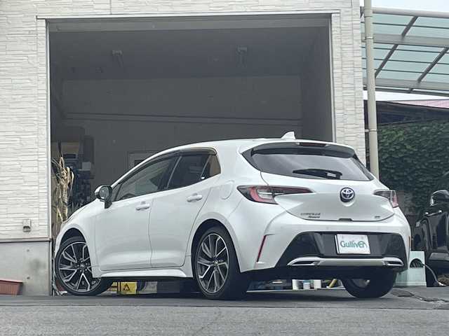 トヨタ カローラ スポーツ ハイブリッドG Z 大分県 2021(令3)年 5万km プラチナホワイトパールマイカ 純正18インチアルミホイール/純正フロアマット/純正ビルトインETC/社外ドラレコ/シートヒーター/横滑り防止装置/衝突被害軽減ブレーキ/オートライト/バックカメラ/クルーズコントロール/スマートキー