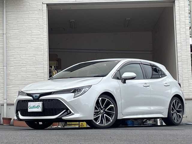 トヨタ カローラ スポーツ ハイブリッドG Z 大分県 2021(令3)年 5万km プラチナホワイトパールマイカ 純正18インチアルミホイール/純正フロアマット/純正ビルトインETC/社外ドラレコ/シートヒーター/横滑り防止装置/衝突被害軽減ブレーキ/オートライト/バックカメラ/クルーズコントロール/スマートキー
