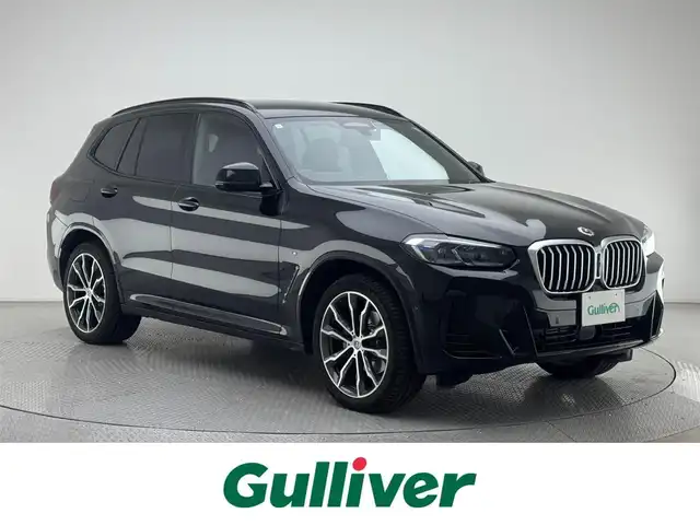 ＢＭＷ ＢＭＷ Ｘ３ xDrive20d Mスポーツ 兵庫県 2023(令5)年 1.3万km サファイアブラックP 純正HDDナビ/（AM/FM/Bluetooth/フルセグTV）/バックカメラ/アラウンドビューモニター/横滑り防止装置/レーンキープアシスト/盗難防止装置/衝突軽減システム/カーテンエアバッグ/インテリジェントセーフティー/アダクティブクルーズコントロール/ブレーキホールド/コーナーセンサー（前後）/レザーシート/シートヒーター（D/N席）/パワーシート（D/N席）/パワーバックドア/ヘッドアップディスプレイ/ブラインドスポットモニター/パドルシフト/アンビエントライト/LEDヘッドライト/BMW LEDレーザーライト/オートライト/オートマチックハイビーム/ビルトインETC/MTモード付AT/4WD/ターボエンジン/前方ドライブレコーダー/ルーフレール/純正OP20インチアルミホイール/Mスポーツ50周年エンブレム/スマートキー/アイドリングストップ/純正フロアマット