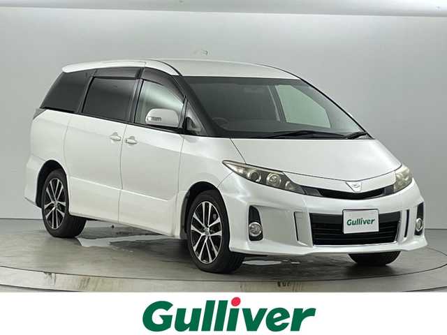 トヨタ エスティマ アエラス 愛知県 2013(平25)年 7.5万km ホワイトパールクリスタルシャイン 禁煙車/ワンオーナー/４WD/純正7インチナビ/（ＤＶＤ/ＣＤ/フルセグ/Bluetooth/ＡＭ/ＦＭ）/１１インチフリップダウンモニター/バックカメラ/オットマン/両側パワースライドドア/スマートキー/プッシュスタート/スペアキー有/純正１８インチアルミホイール/純正エアロ/ＨＩＤヘッドライト/オートライト/純正フロアマット/横滑り防止装置