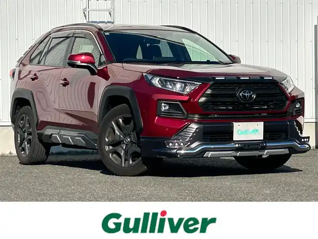 トヨタ ＲＡＶ４ アドベンチャー 熊本県 2022(令4)年 1.2万km センシュアルレッドマイカ 純正ディスプレイオーディオ/・ナビキット/・AM/FM/USB/BT/Miracast/・全周囲カメラ/JAOSプロテクターキット/・バンパープロテクター/・ノーズプロテクター/・サイドプロテクタ＾/・ピラープロテクター/トヨタセーフティセンス/・プリクラッシュセーフティ/・レーントレーシングアシスト/・ブラインドスポットモニター/・パーキングサポートブレーキ/・リアクロストラフィックアラート/・ロードサインアシスト/・オートマチックハイビーム/前席シートヒーター/クーラー/D席メモリ付きパワーシート/電動パーキングブレーキ/オートホールドブレーキ/革巻きステアリング/・ステアリングスイッチ/・ステアリングヒーター/ETC2.0/LEDヘッドライト/LEDフォグランプ/純正アルミホイール/純正フロアマット/純正ドアバイザー/電動格納ミラー/ウインカーミラー/スペアキー