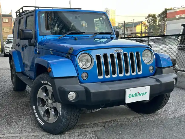 クライスラー・ジープ ジープ ラングラー アンリミテッド サハラ 千葉県 2016(平28)年 8万km 青 取扱説明書、保証書、スペアキー/社外SDナビ　AVIC-RZ103/AM/FM/BT/ワンセグ/クルーズコントロール/ステアリングスイッチ/前後ドライブレコーダー/サイドカメラ/ETC/背面タイヤ/ダウンヒルコントロール/横滑り防止機能/アルパインスピーカー/ルーフキャリア