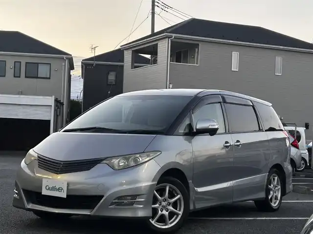 トヨタ エスティマ アエラス Gパッケージ 静岡県 2006(平18)年 16万km ミディアムシルバーメタリック ユーザー買取車両/純正HDDナビ（NHDP-W56S）/[AM/FM/CD/TV/DVD]/純正17インチAW/純正キセノンヘッドライト/エンジンスタートボタン/スマートキー/MTモード付AW/クルーズコントロール/WAC/ETC/フリップダウンモニター/3列シート/オットマン/ウォークスルー/パワーシート（D席のみ）/両側パワースライドドア/AFS/保証書/取扱説明書