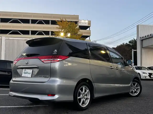 トヨタ エスティマ アエラス Gパッケージ 静岡県 2006(平18)年 16万km ミディアムシルバーメタリック ユーザー買取車両/純正HDDナビ（NHDP-W56S）/[AM/FM/CD/TV/DVD]/純正17インチAW/純正キセノンヘッドライト/エンジンスタートボタン/スマートキー/MTモード付AW/クルーズコントロール/WAC/ETC/フリップダウンモニター/3列シート/オットマン/ウォークスルー/パワーシート（D席のみ）/両側パワースライドドア/AFS/保証書/取扱説明書