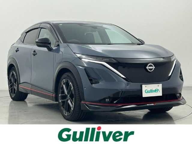 日産 アリア ニスモ B9 e－4ORCE 熊本県 2024(令6)年 0.4万km グレー ワンオーナー　/禁煙車　/プロパイロット 2.0 /ＢＯＳＥサウンド　/サンルーフ/純正ナビ　/全周囲カメラ　/純正前方ドライブレコーダー　/ビルトインＥＴＣ２．０　/パワーバックドア　/全席シートヒーター　/前席パワーシート　/ステアリングヒーター/ヘッドアップディスプレイ/インテリジェントクルーズ/ドライバーモニター/車線維持支援/車線変更支援/側方支援/後側方支援/標識認識機能/駐車支援/横滑り防止/ブラインドスポットモニター/デジタルインナーミラー/ハーフレザーシート/純正フロアマット/純正２０インチAW/オートライト/オートマチックハイビーム/LEDヘッドライト/フォグランプ/スマートキー/プッシュスタート/スペアキー1本/保証書/取扱説明書