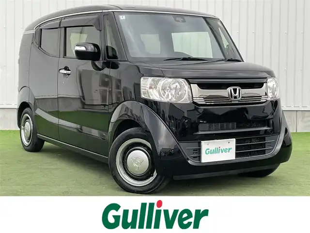 ホンダ Ｎ ＢＯＸ スラッシュ G Lインテリアカラーパッケージ 香川県 2018(平30)年 8.2万km クリスタルブラックパール 社外SDナビ/レザーシート/シートヒーター/革巻きステアリング/ステアリングリモコン（非連動）/社外キセノンライト/オートエアコン/ビルトインETC/プッシュスタート/スマートキー/電動格納ミラー