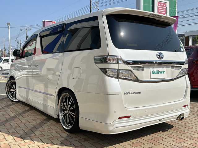 トヨタ ヴェルファイア 2．4Z Gエディション 鳥取県 2012(平24)年 6.7万km ホワイトパールクリスタルシャイン アドミレーションエアロ/社外20インチAW/社外ローダウン/クラジオ革調シートカバー/クラジオフロアマット/社外８インチワイドナビ/社外フリップダウンモニター/フルセグ・Bluetooth/バックカメラ/社外マフラーカッター/スマートキーx2個/両側パワースライド/パワーテールゲート/ウッドコンビハンドル/クルーズコントロール/クリアランスソナー/オートワイパー/オートリトラクトミラー/オートライト/キセノンライト/フォグライト/N席セカンドオットマン/前・セカンドパワーシート/nano-eエアコン/ETCユニット/保証書・取説