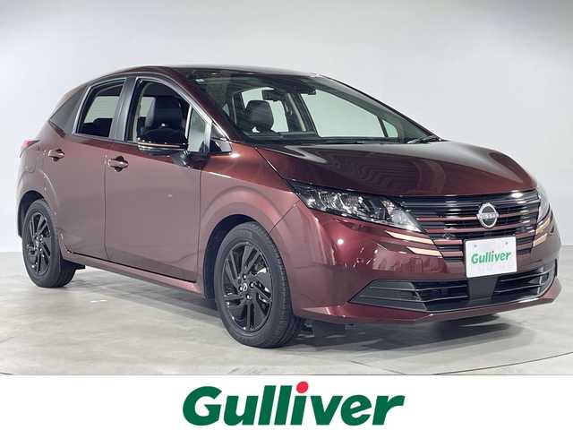日産 ノート X 90周年記念車 福岡県 2024(令6)年 0.2万km バーガンディー 純正9インチナビ/・BT/フルセグTV/HDMI/AppleCarplay/・全方位モニター/エマージェンシーブレーキ/車線逸脱防止支援/速度標識/標識検知支援/オートハイビーム/ブラインドスポットモニター/クリアランスソナー/置くだけ充電/デジタルインナーミラー/革巻きステアリング/・ステアリングヒーター/・ステアリングリモコン/レザーシート/・シートヒーター/LEDヘッドライト/・オートライト/・フォグランプ/前方ドライブレコーダー/ETC2.0/純正16インチアルミホイール/純正フロアマット