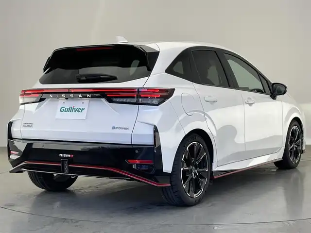 日産 オーラ ニスモ 愛知県 2022(令4)年 1.8万km ピュアホワイトパール 純正９型ナビＴＶ　ＨＤＭＩ　デジタルインナーミラー　全方位カメラ　プロパイロット　シートヒータ　ワイヤレス充電　純正ニスモスポイラー　電動パーキングブレーキ　ＬＥＤオートライト　オートホールド　ハンドル支援　エマージェンシーブレーキ　コーナーセンサー　ETC2.0　フォグランップ　禁煙車