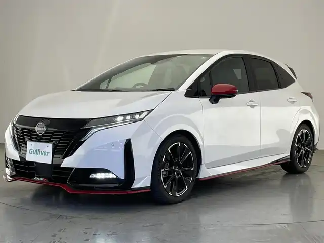 日産 オーラ ニスモ 愛知県 2022(令4)年 1.8万km ピュアホワイトパール 純正９型ナビＴＶ　ＨＤＭＩ　デジタルインナーミラー　全方位カメラ　プロパイロット　シートヒータ　ワイヤレス充電　純正ニスモスポイラー　電動パーキングブレーキ　ＬＥＤオートライト　オートホールド　ハンドル支援　エマージェンシーブレーキ　コーナーセンサー　ETC2.0　フォグランップ　禁煙車