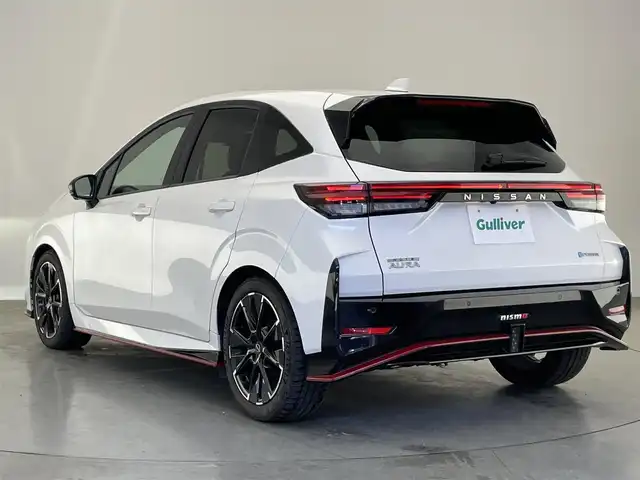 日産 オーラ ニスモ 愛知県 2022(令4)年 1.8万km ピュアホワイトパール 純正９型ナビＴＶ　ＨＤＭＩ　デジタルインナーミラー　全方位カメラ　プロパイロット　シートヒータ　ワイヤレス充電　純正ニスモスポイラー　電動パーキングブレーキ　ＬＥＤオートライト　オートホールド　ハンドル支援　エマージェンシーブレーキ　コーナーセンサー　ETC2.0　フォグランップ　禁煙車