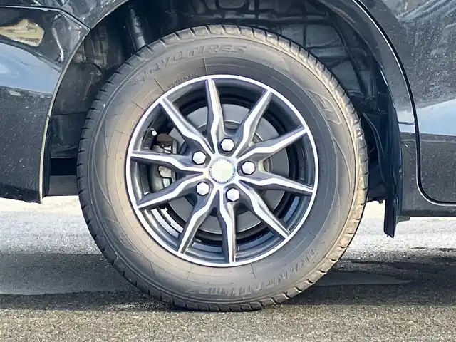 トヨタ ヴォクシー ハイブリッド V 静岡県 2014(平26)年 11.8万km ブラック エンジンスタートボタン/パワーステアリング/パワーウィンドウ/アイドリングストップ/スマートキー/Wオートエアコン/クルーズコントロール/ALPINE製11インチナビ（CD/DVD/BT/フルセグ）/ALPINE製10.2インチ後席モニター/バックカメラ/フロアマット/三列シート/ウォークスルー/D席N席シートヒーター/布シート/両側パワースライドドア/社外アルミホイール/ABS/オートライト/W+サイドエアバッグ/カーテンエアバッグ/衝突軽減システム