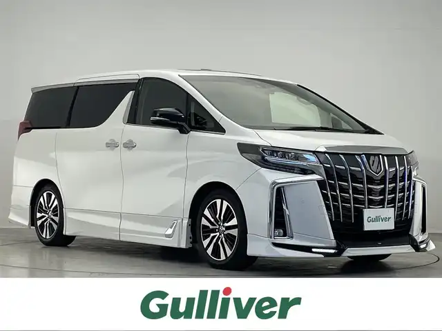 トヨタ アルファード S Cパッケージ 宮城県 2021(令3)年 3.1万km ホワイトパールクリスタルシャイン /禁煙車//純正９インチディスプレイオーディオ/（CD/DVD/BT/USB/フルセグ/Miracast)//TRDエアロ(フロント・サイド・リア）//フリップダウンモニター//バック・フロント・左サイドカメラ//ビルトインETC2.0//サンルーフ//１列目＋２列目パワーシート//１列目シートヒーター//１列目エアーシート//ステアリングヒーター//オットマン//デジタルインナーミラー//ワイヤレス充電//AC100V電源//前後ドラレコ//パワーバックドア//レザーシート//３眼LEDヘッドライト//オートライト//トヨタセーフティセンス/・オートハイビーム/・プリクラッシュセーフティ/・レーントレーシングアシスト/・レーダークルーズコントロール//BSM//クリアランスソナー//MTモード付AT//電動パーキングブレーキ//オートブレーキホールド//プッシュスタート//スマートキー