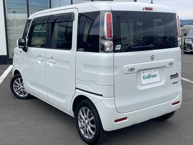 スズキ スペーシア HYBRID X 道東・釧路十勝 2022(令4)年 6.4万km ピュアホワイトP ・４WD/・純正9インチナビ/（フルセグTV Bluetooth CD DVD USB ）/・全周囲カメラ/・衝突軽減ブレーキサポート/・車線逸脱防止機能/・コーナーセンサー/・両側パワースライドドア/・後席サーキュレーター/・後席サンシェード/・運転席、助手席シートヒーター/・ステアリングスイッチ/・アイドリングストップ/・社外前方ドライブレコーダー/・オートライト/・ハイビームアシスト/・ヘッドライトレベライザー/・ドアバイザー/・フルオートエアコン/・電動格納ミラー/・スマートキー/・プッシュスタート/・社外14インチアルミホイール/・スチールホイール付夏タイヤ積込