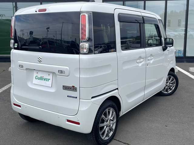 スズキ スペーシア HYBRID X 道東・釧路十勝 2022(令4)年 6.4万km ピュアホワイトP ・４WD/・純正9インチナビ/（フルセグTV Bluetooth CD DVD USB ）/・全周囲カメラ/・衝突軽減ブレーキサポート/・車線逸脱防止機能/・コーナーセンサー/・両側パワースライドドア/・後席サーキュレーター/・後席サンシェード/・運転席、助手席シートヒーター/・ステアリングスイッチ/・アイドリングストップ/・社外前方ドライブレコーダー/・オートライト/・ハイビームアシスト/・ヘッドライトレベライザー/・ドアバイザー/・フルオートエアコン/・電動格納ミラー/・スマートキー/・プッシュスタート/・社外14インチアルミホイール/・スチールホイール付夏タイヤ積込