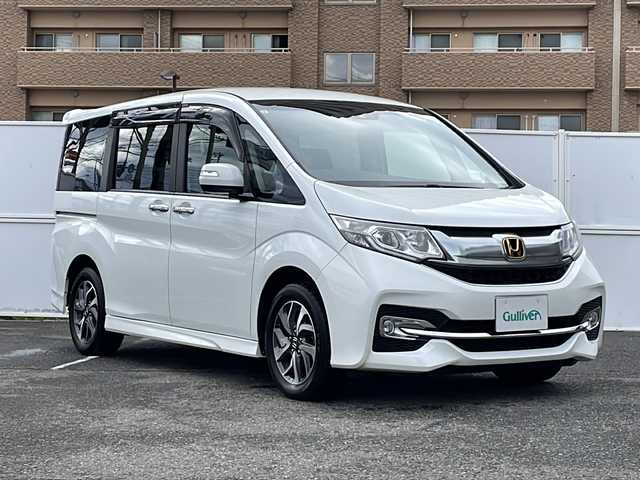 ホンダ ステップワゴン スパーダ ホンダセンシング 道東・釧路十勝 2017(平29)年 9.2万km ホワイトオーキッドパール 純正ナビ/・フルセグテレビ/・ＣＤ、ＤＶＤ、ＳＤ/・ＢＴ/・ＵＳＢ/・ＩＰＯＤ/・ラジオ/フリップダウンモニター/クルーズコントロール/両側パワースライドドア/社外エンジンスターター/電動格納ミラー/パドルシフト/ステアリングスイッチ/衝突軽減装置/車線逸脱警報装置