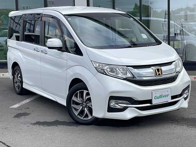 ホンダ ステップワゴン スパーダ ホンダセンシング 道東・釧路十勝 2017(平29)年 9.2万km ホワイトオーキッドパール ・4WD/・純正9インチSDナビ/(BT CD DVD フルセグ FM AM)/・バックカメラ/・純正11インチフリップダウンモニター/・クルーズコントロール/・両側パワースライドドア/・ヒーテッドドアミラー/・社外エンジンスターター/・電動格納ミラー/・パドルシフト/・ステアリングスイッチ/・革調シートカバー/・ホンダセンシング/・衝突軽減装置/・車線逸脱警報装置/・フロントワイパーデアイサー/・MTモード付AT/・オートライト/・LEDヘッドライト/・フォグライト/・スマートキー/・プッシュスタート/・純正１６インチアルミホイール