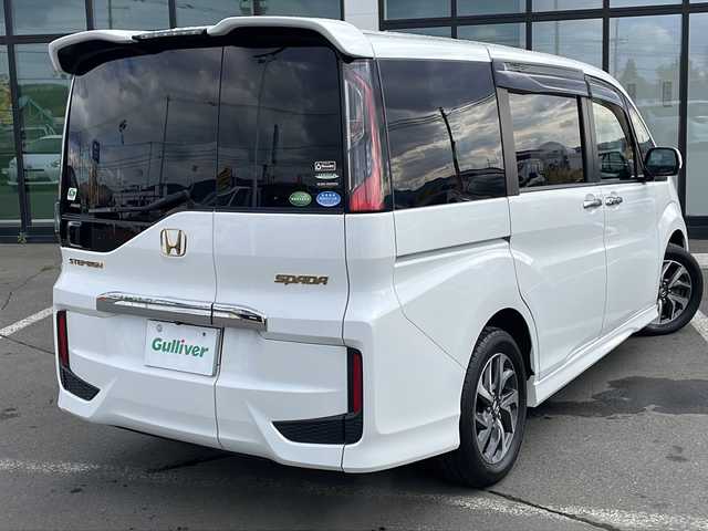 ホンダ ステップワゴン スパーダ ホンダセンシング 道東・釧路十勝 2017(平29)年 9.2万km ホワイトオーキッドパール ・4WD/・純正9インチSDナビ/(BT CD DVD フルセグ FM AM)/・バックカメラ/・純正11インチフリップダウンモニター/・クルーズコントロール/・両側パワースライドドア/・ヒーテッドドアミラー/・社外エンジンスターター/・電動格納ミラー/・パドルシフト/・ステアリングスイッチ/・革調シートカバー/・ホンダセンシング/・衝突軽減装置/・車線逸脱警報装置/・フロントワイパーデアイサー/・MTモード付AT/・オートライト/・LEDヘッドライト/・フォグライト/・スマートキー/・プッシュスタート/・純正１６インチアルミホイール