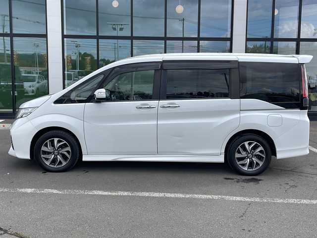 ホンダ ステップワゴン スパーダ ホンダセンシング 道東・釧路十勝 2017(平29)年 9.2万km ホワイトオーキッドパール ・4WD/・純正9インチSDナビ/(BT CD DVD フルセグ FM AM)/・バックカメラ/・純正11インチフリップダウンモニター/・クルーズコントロール/・両側パワースライドドア/・ヒーテッドドアミラー/・社外エンジンスターター/・電動格納ミラー/・パドルシフト/・ステアリングスイッチ/・革調シートカバー/・ホンダセンシング/・衝突軽減装置/・車線逸脱警報装置/・フロントワイパーデアイサー/・MTモード付AT/・オートライト/・LEDヘッドライト/・フォグライト/・スマートキー/・プッシュスタート/・純正１６インチアルミホイール