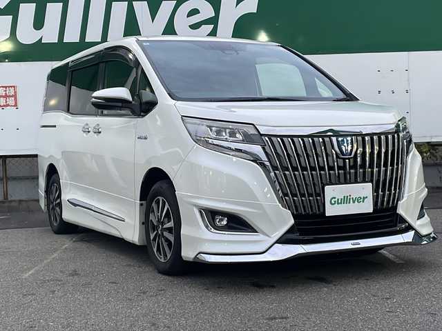 トヨタ エスクァイア ハイブリッド Gi 福島県 2018(平30)年 8.3万km ホワイトパールクリスタルシャイン 純正SDナビ/（FM/AM/DVD/Bluetooth）/レザーシート/バックカメラ/フルセグTV/衝突軽減ブレーキ/レーンキープアシスト/横滑り防止装置/両側電動スライド/ETC/LEDヘッドライト/純正フロアマット/後席用モニター/プッシュスタート/スマートキー