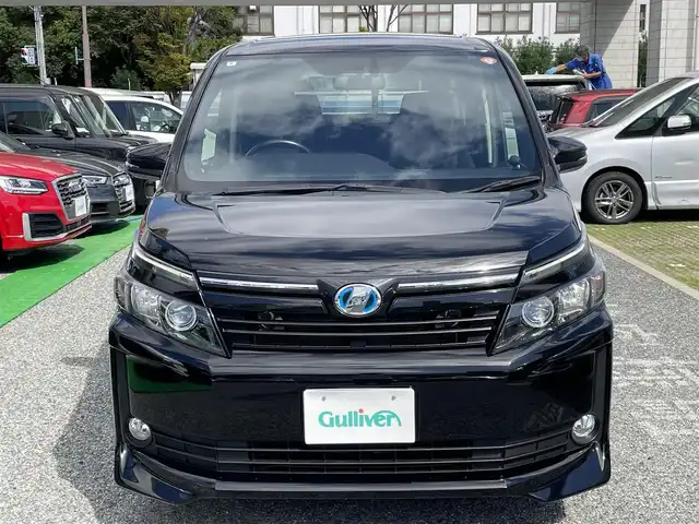 トヨタ ヴォクシー ハイブリッド V 兵庫県 2014(平26)年 8.4万km ブラック 外部検査実施済み/・純正9インチメモリーナビ（NSZT-Y62G）/・地デジ/DVD/BT/・バックカメラ/・ステアリングリモコン/・カロッツェリアツイーター/・ナビTVキャンセラー/・左パワースライドドア/・ビルトインETC/・純正15インチAW/・前席シートヒーター/・置くだけ充電/・オートLEDヘッドランプ/・スペアキー