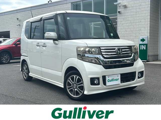 ホンダ Ｎ ＢＯＸ カスタム G Lパッケージ 鳥取県 2013(平25)年 14.6万km プレミアムホワイトパール ワンオーナー/純正ナビ(VXM-128VS)/ワンセグテレビ/バックカメラ/Ｌパッケージ/フルオート・エアコンディショナー/ナビ装着用スペシャルパッケージ/ディスチャージヘッドライト(オートライトコントロール機構付)/アイドリングストップシステム/ドアバイザー/プッシュスタート/片側パワースライドドア/ETC