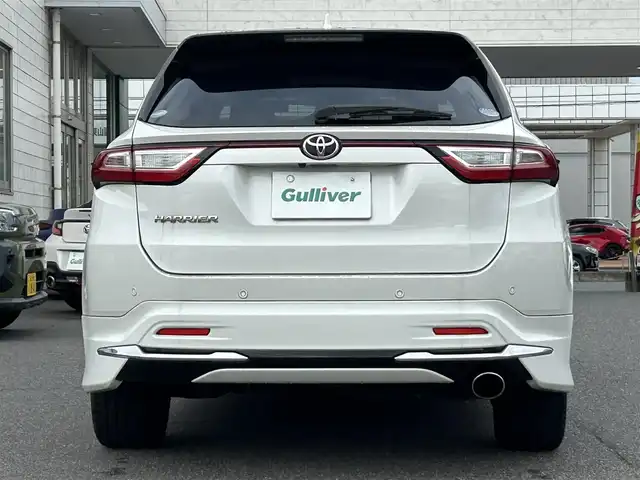 トヨタ ハリアー プレミアム 広島県 2018(平30)年 10.1万km ホワイトパールクリスタルシャイン 衝突軽減ブレーキ/レーンディパーチャーアラーム/純正SDナビ/地デジTV/【NSZT-Y66T】/純正CD/DVD/SD/Bluetooth/バックカメラ/社外USB端子/モデリスタエアロ/純正18インチアルミ/パワーバックドア/サンルーフ/スマートキー/ハーフレザーシート/運転席パワーシート/前後コーナーセンサー/ドライブレコーダー/ウッドコンビステア/電格ウィンカーミラー/ビルトインETC/トノカバー/保証書/取扱説明書/スペアキー（スマートキー）/純正フロアマット
