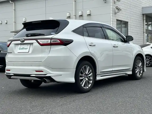 トヨタ ハリアー プレミアム 広島県 2018(平30)年 10.1万km ホワイトパールクリスタルシャイン 衝突軽減ブレーキ/レーンディパーチャーアラーム/純正SDナビ/地デジTV/【NSZT-Y66T】/純正CD/DVD/SD/Bluetooth/バックカメラ/社外USB端子/モデリスタエアロ/純正18インチアルミ/パワーバックドア/サンルーフ/スマートキー/ハーフレザーシート/運転席パワーシート/前後コーナーセンサー/ドライブレコーダー/ウッドコンビステア/電格ウィンカーミラー/ビルトインETC/トノカバー/保証書/取扱説明書/スペアキー（スマートキー）/純正フロアマット