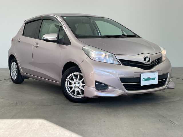 トヨタ ヴィッツ F 兵庫県 2011(平23)年 6.9万km ローズメタリックオパール ・社外ナビ（CD/DVD/HDD/TV)/・バックカメラ/・ETC/・社外前後ドライブレコーダー/・社外14インチアルミホイール/・社外革調シートカバー/・フロントスポイラー/・キーレスエントリー/・ヘッドライトレベライザー