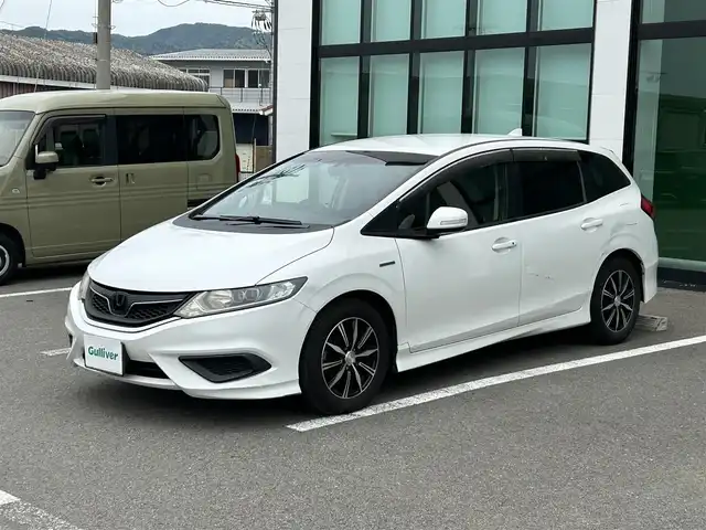 ホンダ ジェイド ハイブリッド 和歌山県 2016(平28)年 12.2万km ホワイトオーキッドパール 社外ナビ/(AM/FM/DVD/Bluetooth)/バックカメラ/衝突軽減ブレーキ/横滑り防止機能/クルーズコントロール/アイドリングストップ/ETC/ドラレコ/プッシュスタート/スマートキー/ハンドルスイッチ/オートライト/カーテンエアバック/ECOモード/純正マット