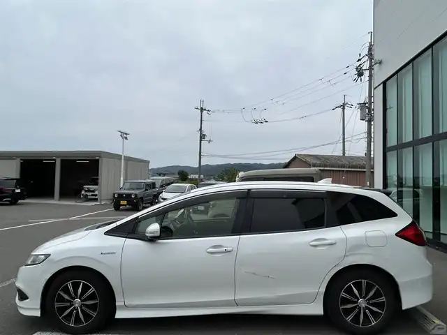 ホンダ ジェイド ハイブリッド 和歌山県 2016(平28)年 12.2万km ホワイトオーキッドパール 社外ナビ/(AM/FM/DVD/Bluetooth)/バックカメラ/衝突軽減ブレーキ/横滑り防止機能/クルーズコントロール/アイドリングストップ/ETC/ドラレコ/プッシュスタート/スマートキー/ハンドルスイッチ/オートライト/カーテンエアバック/ECOモード/純正マット