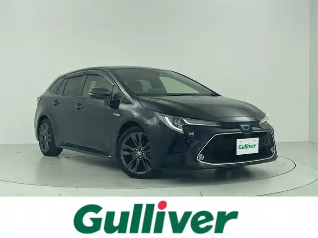 トヨタ カローラツーリング ハイブリッド ダブルバイビー 大阪府 2020(令2)年 7.9万km スパークリングブラックパールクリスタルシャイン トヨタセーフティセンス/　・プリクラッシュセーフティ/　・レーントレーシングアシスト/　・レーンディパーチャーアラート/　・レーダークルーズコントロール/　・オートマチックハイビーム/　・ロードサインアシスト/　・発進遅れ告知機能/　・リアトラフィックアラート/　・インテリジェントクリアランスソナー/　・パーキングサポートブレーキ/デジタルインナーミラー/ワイヤレス充電器/純正ディスプレイオーディオ/　Bluetooth/フルセグ/AM/FM/バックカメラ/LEDへっどらいと/オートライト/フォグランプ/ハーフレザーシート/前席シートヒーター/ステアリングヒーター/トノカバー/ヘッドアップディスプレイ/スマートキー