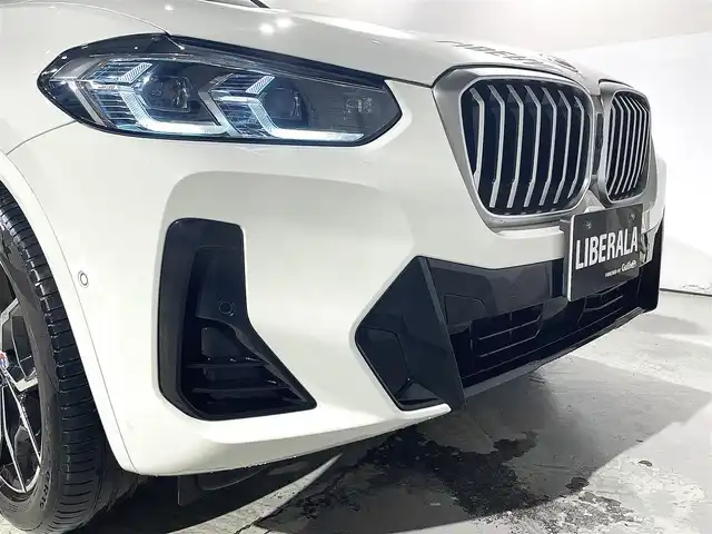 ＢＭＷ ＢＭＷ Ｘ３ 20d xDrive Mスポーツ 道央・札幌 2023(令5)年 2.3万km アルピンホワイトⅢ 電動パノラマ・ガラス・サンルーフ/ドライビング・アシスト・プロフェッショナル/・高速道路渋滞ハンズ・オフ・アシスト/・トラフィック・サイン・アシスト（速度制限認識）/・ACC/・ステアリング＆レーン・コントロール・アシスト/・レーン・ディパーチャー・ウォーニング/（車線逸脱警告システム）/・レーン・チェンジ・アシスト/・レーン・キーピング・アシスト/・クロス・トラフィック・ウォーニング/・クロスロード・ウォーニング/・前車接近警告機能/・後車衝突警告機能/・衝突回避・被害軽減ブレーキ/・エマージェンシー・ストップ・アシスト/パーキングアシストプラス/・PDC/・パーキングアシスト/・トップビュー＋３Dビュー/・サイドビューカメラ/・リアビューカメラ（予想進路表示機能付）/アダプティブLEDヘッドライト/電動フロントシート/運転席メモリー機能付/フロントシートヒーティング/リアシートヒーティング/BMWライブコックピット/・１２・３インチマルチディスプレイ・メーターパネル/・１２・３インチワイド・コントロール・ディスプレイ/・HDDナビ