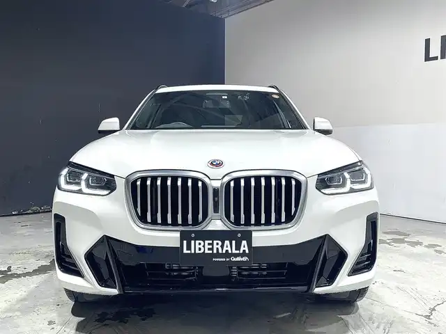 ＢＭＷ ＢＭＷ Ｘ３ 20d xDrive Mスポーツ 道央・札幌 2023(令5)年 2.3万km アルピンホワイトⅢ 電動パノラマ・ガラス・サンルーフ/ドライビング・アシスト・プロフェッショナル/・高速道路渋滞ハンズ・オフ・アシスト/・トラフィック・サイン・アシスト（速度制限認識）/・ACC/・ステアリング＆レーン・コントロール・アシスト/・レーン・ディパーチャー・ウォーニング/（車線逸脱警告システム）/・レーン・チェンジ・アシスト/・レーン・キーピング・アシスト/・クロス・トラフィック・ウォーニング/・クロスロード・ウォーニング/・前車接近警告機能/・後車衝突警告機能/・衝突回避・被害軽減ブレーキ/・エマージェンシー・ストップ・アシスト/パーキングアシストプラス/・PDC/・パーキングアシスト/・トップビュー＋３Dビュー/・サイドビューカメラ/・リアビューカメラ（予想進路表示機能付）/アダプティブLEDヘッドライト/電動フロントシート/運転席メモリー機能付/フロントシートヒーティング/リアシートヒーティング/BMWライブコックピット/・１２・３インチマルチディスプレイ・メーターパネル/・１２・３インチワイド・コントロール・ディスプレイ/・HDDナビ