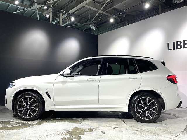 ＢＭＷ ＢＭＷ Ｘ３ 20d xDrive Mスポーツ 道央・札幌 2023(令5)年 2.3万km アルピンホワイトⅢ 電動パノラマ・ガラス・サンルーフ/ドライビング・アシスト・プロフェッショナル/・高速道路渋滞ハンズ・オフ・アシスト/・トラフィック・サイン・アシスト（速度制限認識）/・ACC/・ステアリング＆レーン・コントロール・アシスト/・レーン・ディパーチャー・ウォーニング/（車線逸脱警告システム）/・レーン・チェンジ・アシスト/・レーン・キーピング・アシスト/・クロス・トラフィック・ウォーニング/・クロスロード・ウォーニング/・前車接近警告機能/・後車衝突警告機能/・衝突回避・被害軽減ブレーキ/・エマージェンシー・ストップ・アシスト/パーキングアシストプラス/・PDC/・パーキングアシスト/・トップビュー＋３Dビュー/・サイドビューカメラ/・リアビューカメラ（予想進路表示機能付）/アダプティブLEDヘッドライト/電動フロントシート/運転席メモリー機能付/フロントシートヒーティング/リアシートヒーティング/BMWライブコックピット/・１２・３インチマルチディスプレイ・メーターパネル/・１２・３インチワイド・コントロール・ディスプレイ/・HDDナビ