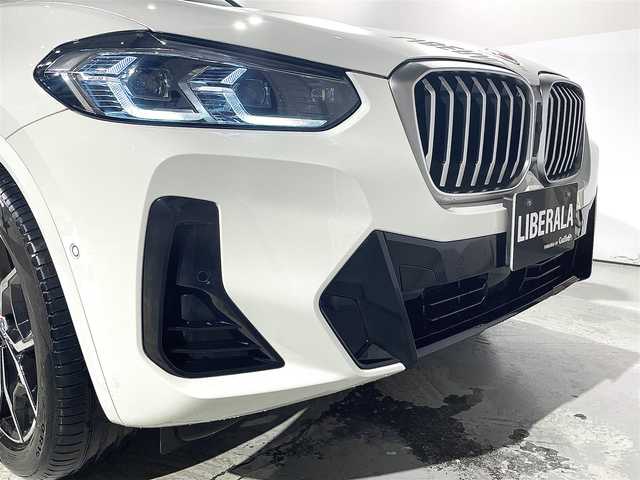 ＢＭＷ ＢＭＷ Ｘ３ 20d xDrive Mスポーツ 道央・札幌 2023(令5)年 2.3万km アルピンホワイトⅢ 電動パノラマ・ガラス・サンルーフ/ドライビング・アシスト・プロフェッショナル/・高速道路渋滞ハンズ・オフ・アシスト/・トラフィック・サイン・アシスト（速度制限認識）/・ACC/・ステアリング＆レーン・コントロール・アシスト/・レーン・ディパーチャー・ウォーニング/（車線逸脱警告システム）/・レーン・チェンジ・アシスト/・レーン・キーピング・アシスト/・クロス・トラフィック・ウォーニング/・クロスロード・ウォーニング/・前車接近警告機能/・後車衝突警告機能/・衝突回避・被害軽減ブレーキ/・エマージェンシー・ストップ・アシスト/パーキングアシストプラス/・PDC/・パーキングアシスト/・トップビュー＋３Dビュー/・サイドビューカメラ/・リアビューカメラ（予想進路表示機能付）/アダプティブLEDヘッドライト/電動フロントシート/運転席メモリー機能付/フロントシートヒーティング/リアシートヒーティング/BMWライブコックピット/・１２・３インチマルチディスプレイ・メーターパネル/・１２・３インチワイド・コントロール・ディスプレイ/・HDDナビ