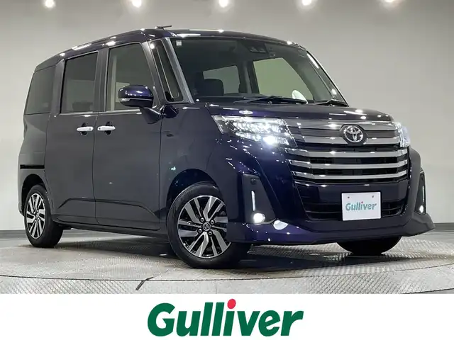 トヨタ ルーミー カスタムG 愛知県 2022(令4)年 1.4万km クールバイオレットクリスタルシャイン 純正9インチナビ/（Bluetooth/AM/FM/DVD）/スマートアシスト/　-衝突軽減ブレーキ/　-先行車発進/　-車線逸脱警報/　-ふらつき警報/　-標識認識/両側電動スライドドア/レーダークルーズコントロール/ドライブレコーダー/LEDヘッドライト/純正ビルトインETC/バックカメラ/コーナーセンサー/スマートキー/オートブレーキホールド/純正14インチAW/アイドリングストップ